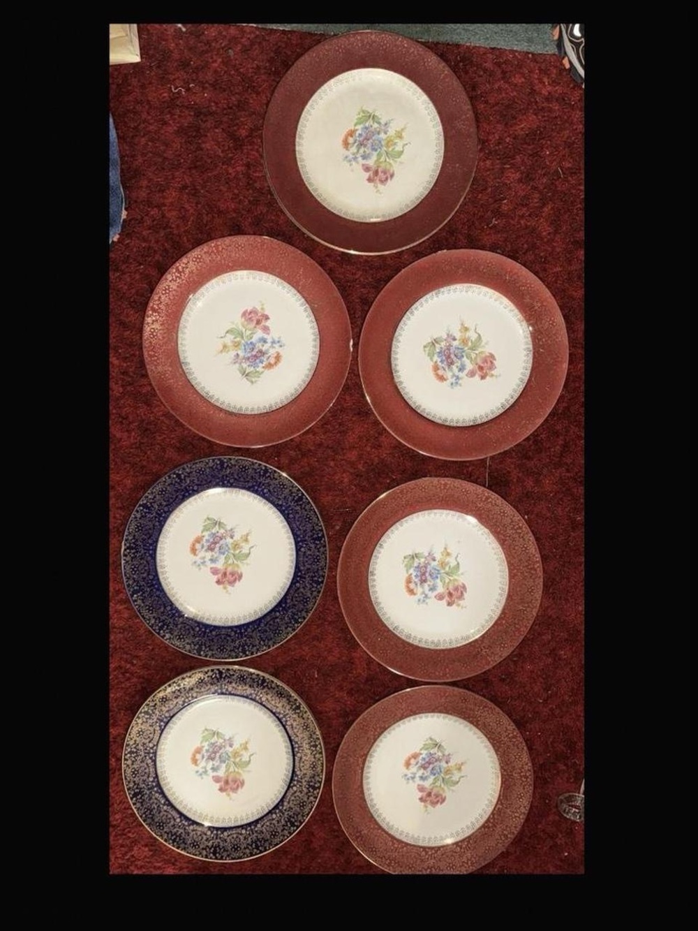 Seven Homer Laughlin Floral Dinner Plates with Red Gold and Blue Borders